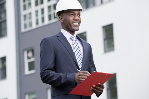 450742081 Businessman happily overseeing his work